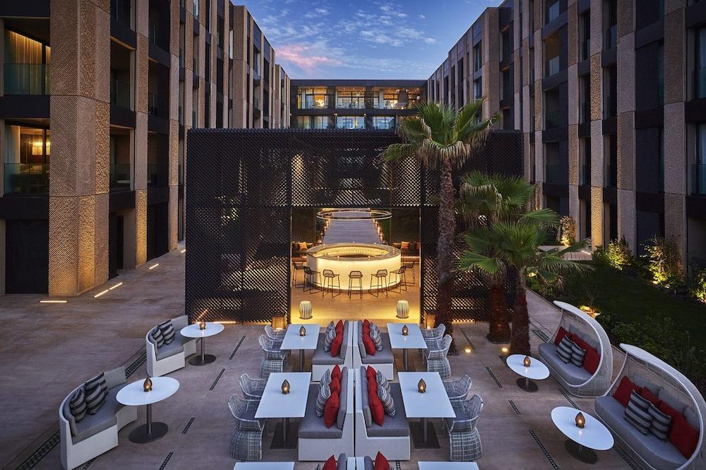  A stylish outdoor venue in Marrakech with a modern design, cozy seating areas, and a vibrant ambiance, making it a fantastic option for weddings that balance beauty and budget.